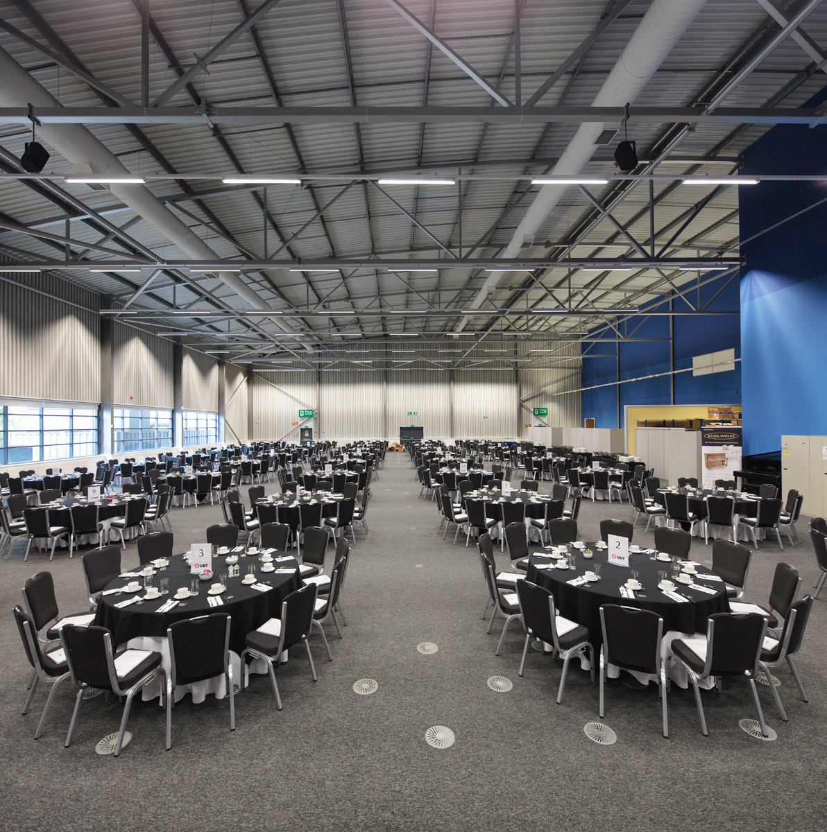 Tables set for conference and seminar in large room
